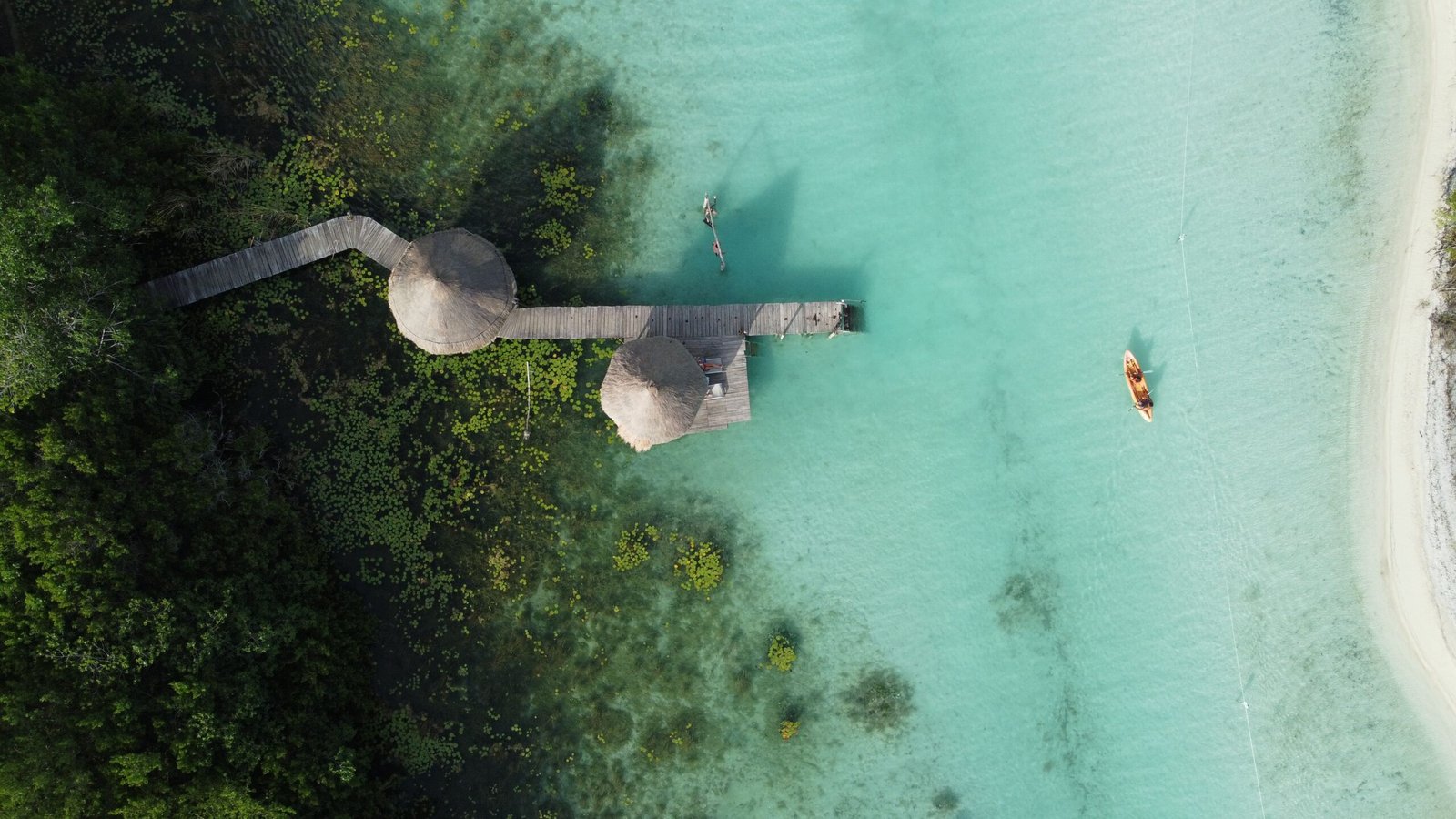 Take a boat tour of the Bacalar Chico National Park