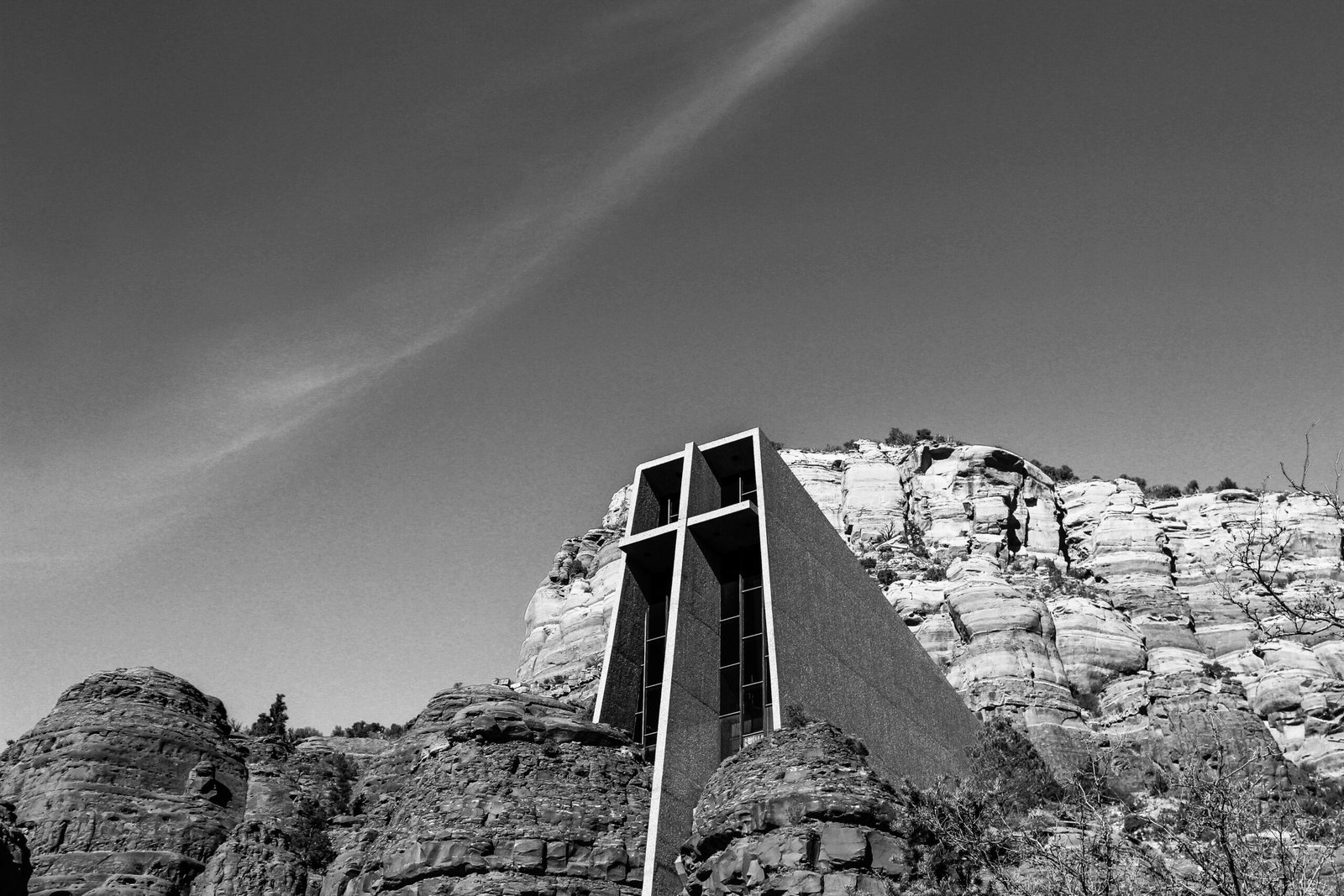 Visit the Chapel of the Holy Cross, a stunning adobe church built into the red rocks.