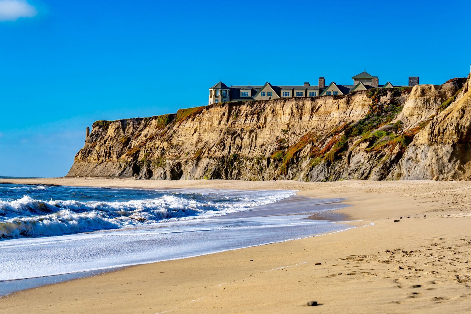 Relax on the pristine beaches of Half Moon Bay.