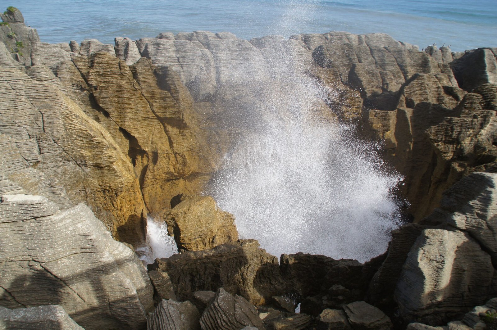 Visit La Bufadora, a natural blowhole that creates impressive sea sprays.