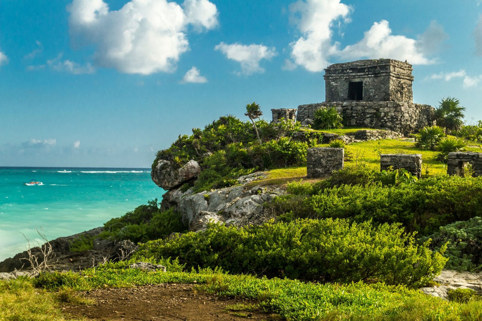 Visit the Tulum Archaeological Site for stunning Mayan ruins overlooking the Caribbean Sea