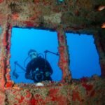 Discover impressive shipwrecks while diving at Paradise Lakes