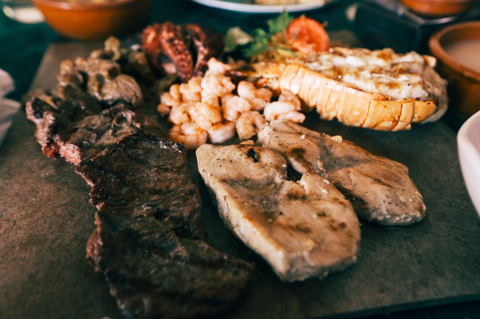 Dine at The Surf Hut for fresh seafood with a beach view.