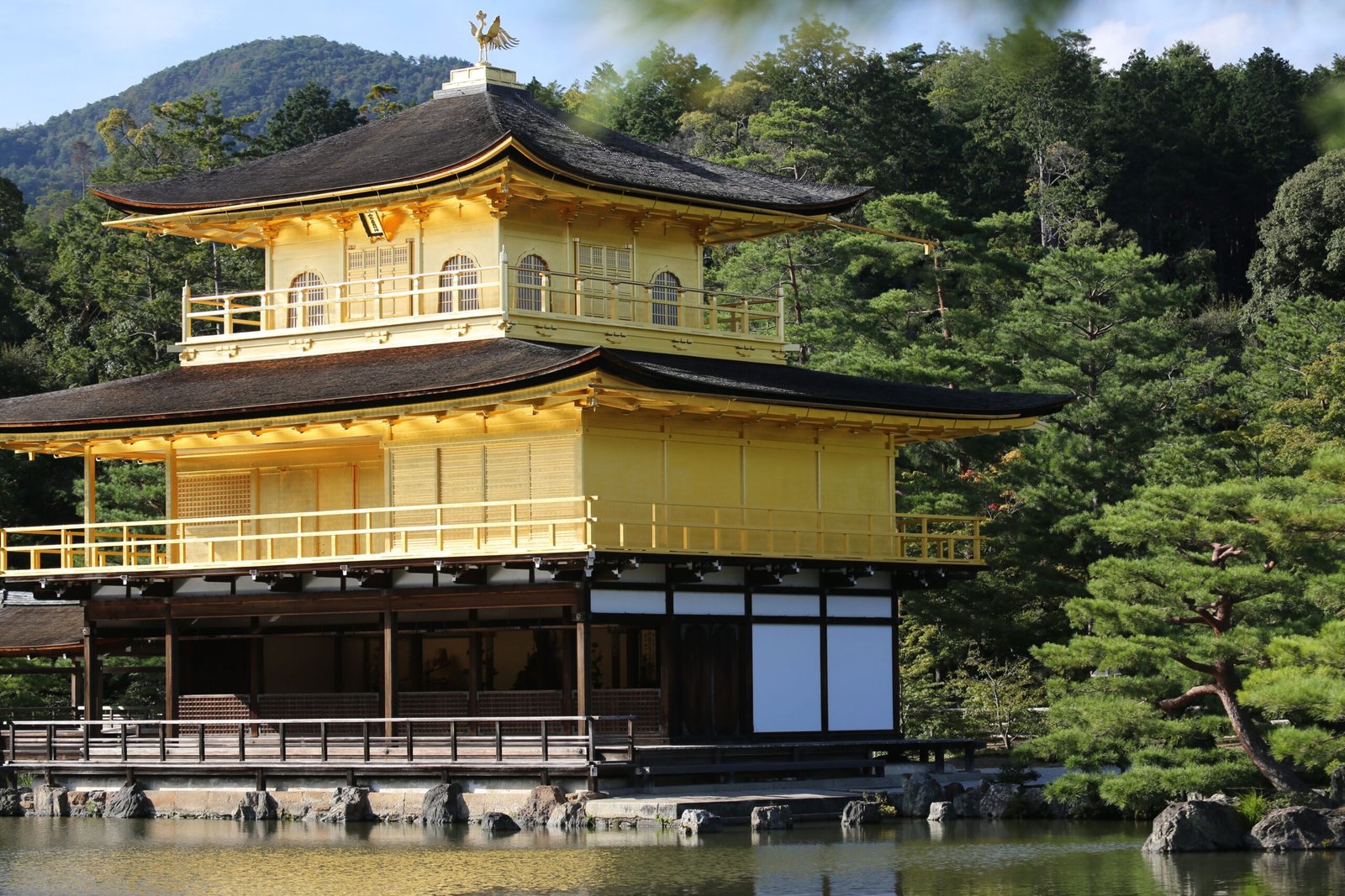 Explore the historic temples of Kyoto, including Kinkaku-ji (Golden Pavilion).