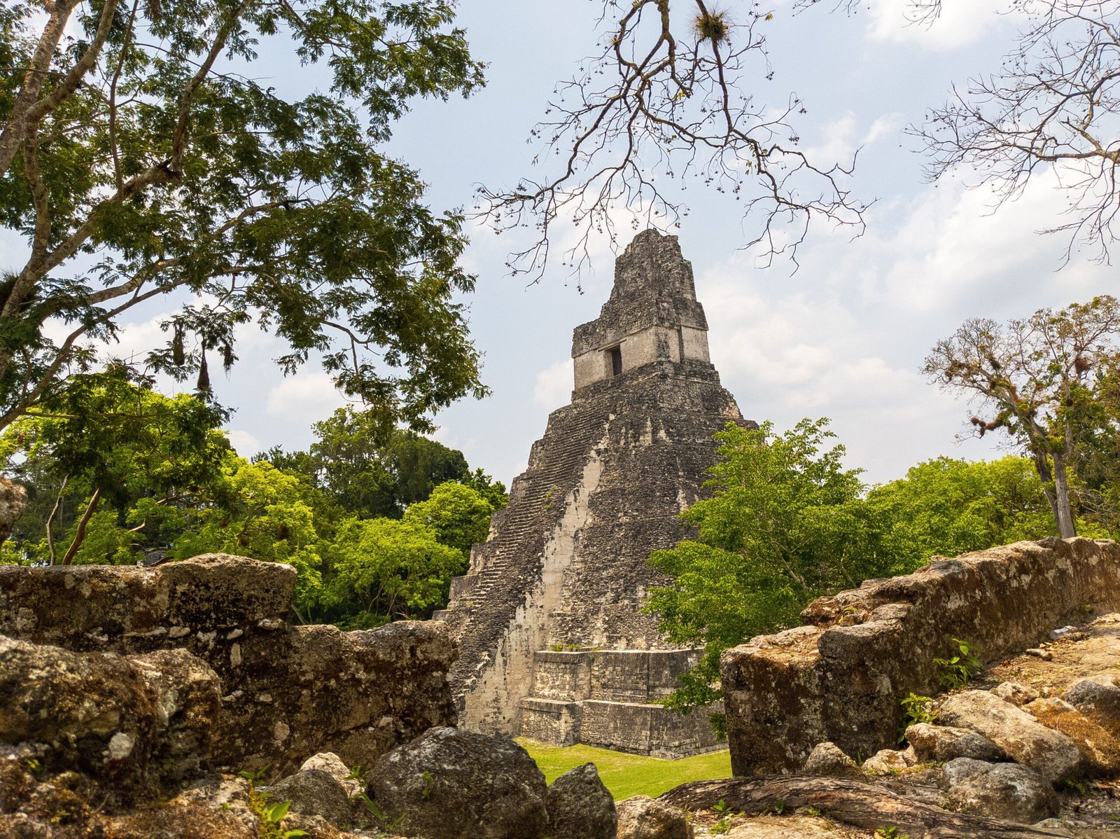 Explore the ancient ruins of Tikal National Park.