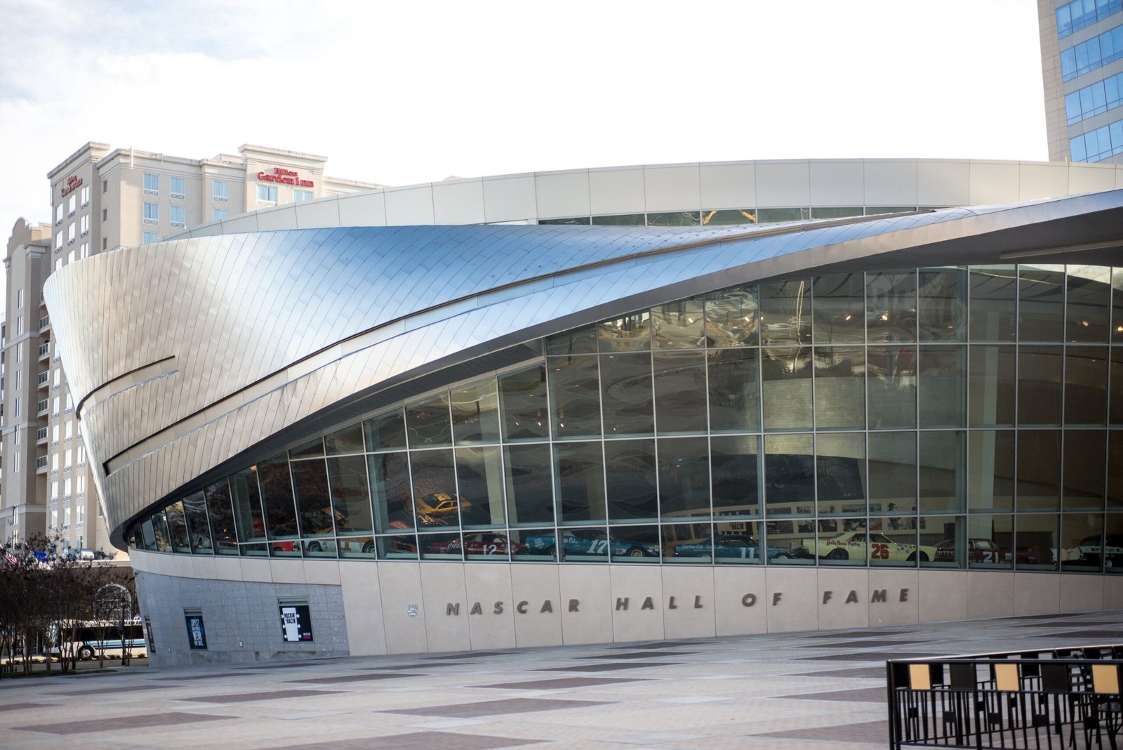 Visit the NASCAR Hall of Fame Plaza to see the iconic names and cars displayed.