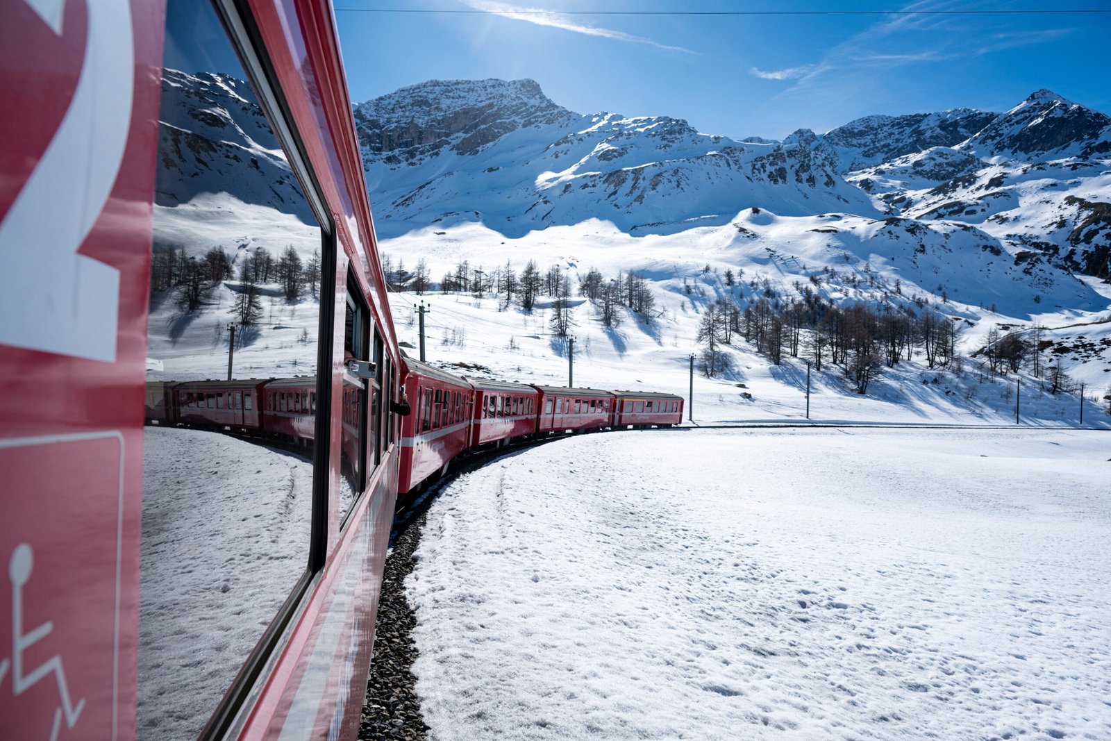 Take a scenic train ride through the snow-covered mountains