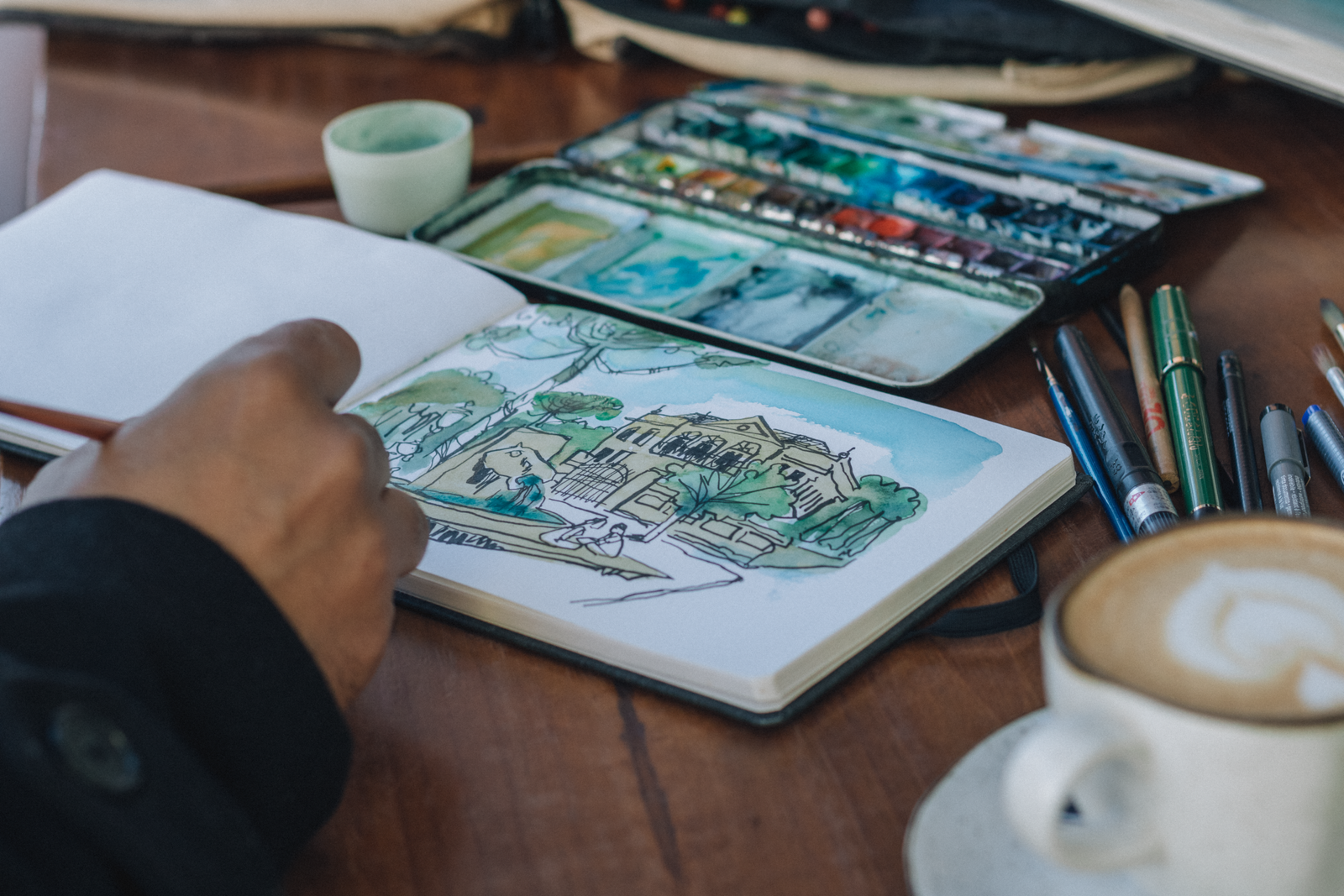 Start a sketchbook and draw the scenes around you.