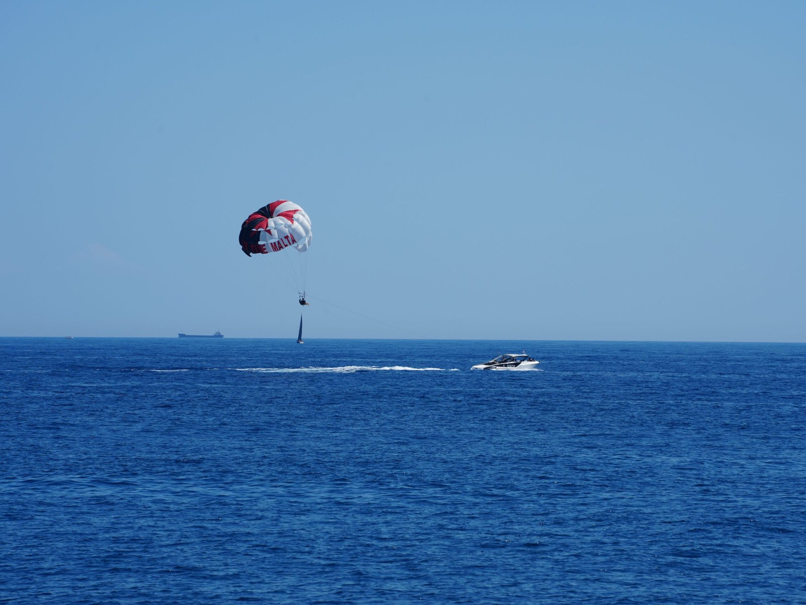 Enjoy water activities like parasailing at the Emerald Coast.