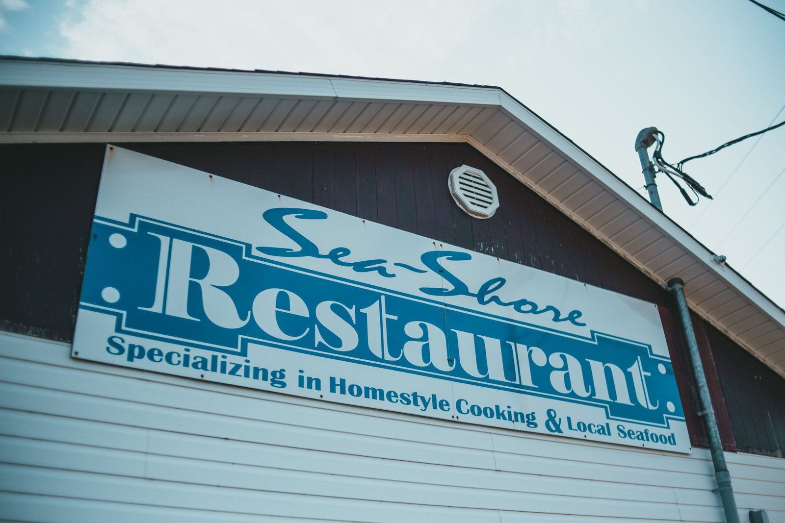 Dine at the popular Sea Biscuit Café, known for its local seafood.